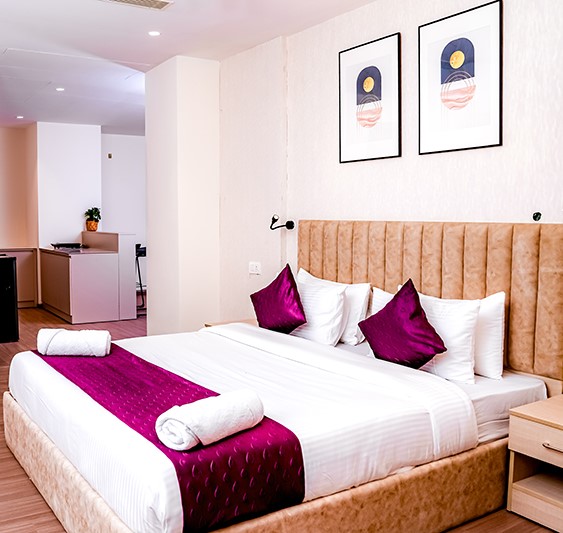Modern suite room with king size bed Casa Hotel Hyderabad
